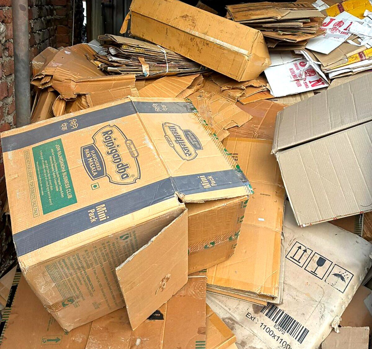 Baled OCC cardboard boxes and kraft cartons collected for paper mill recycling